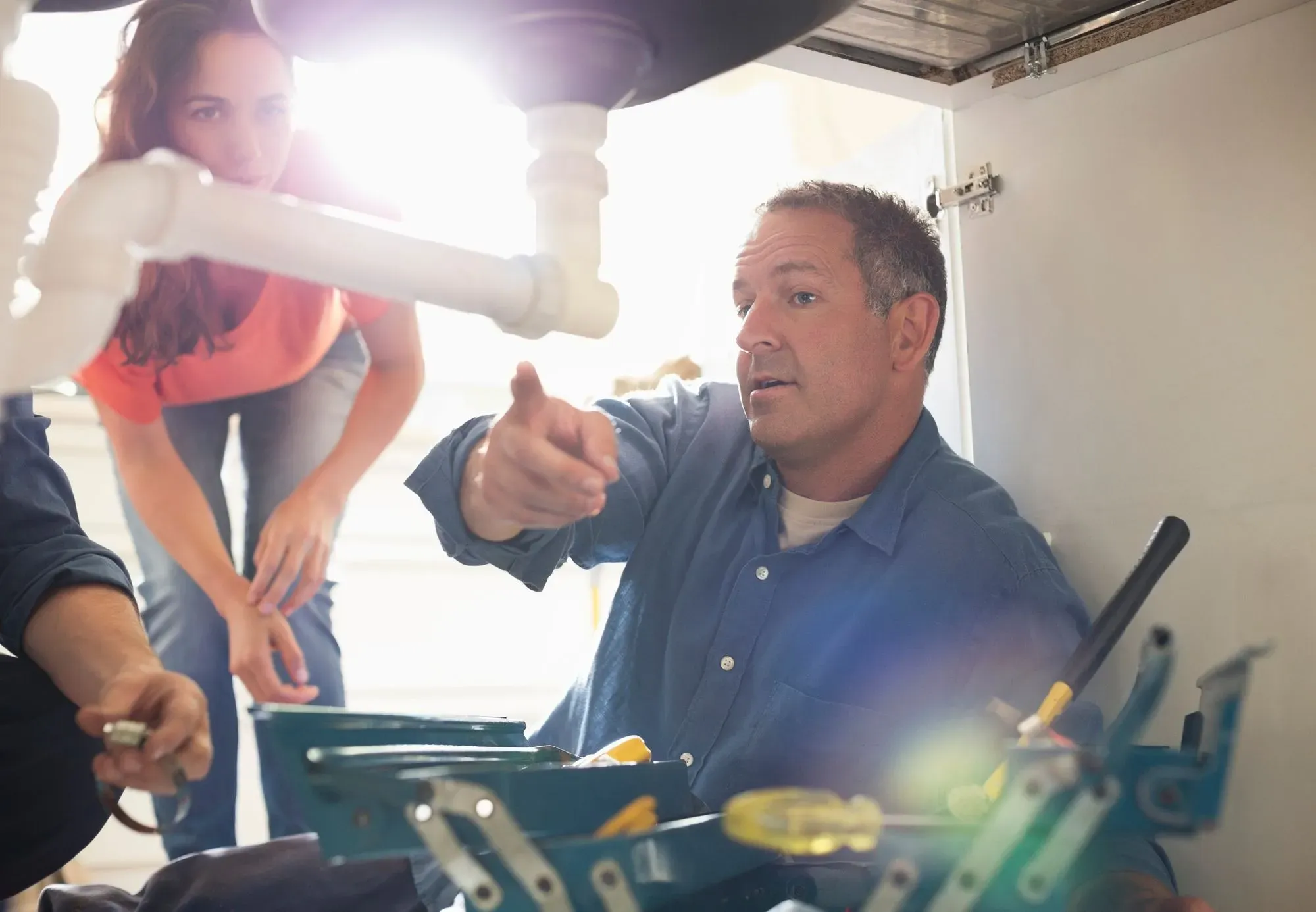 Plumber assisting a customer