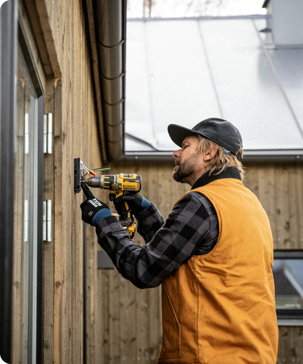 Roofing crew member inspecting a roof